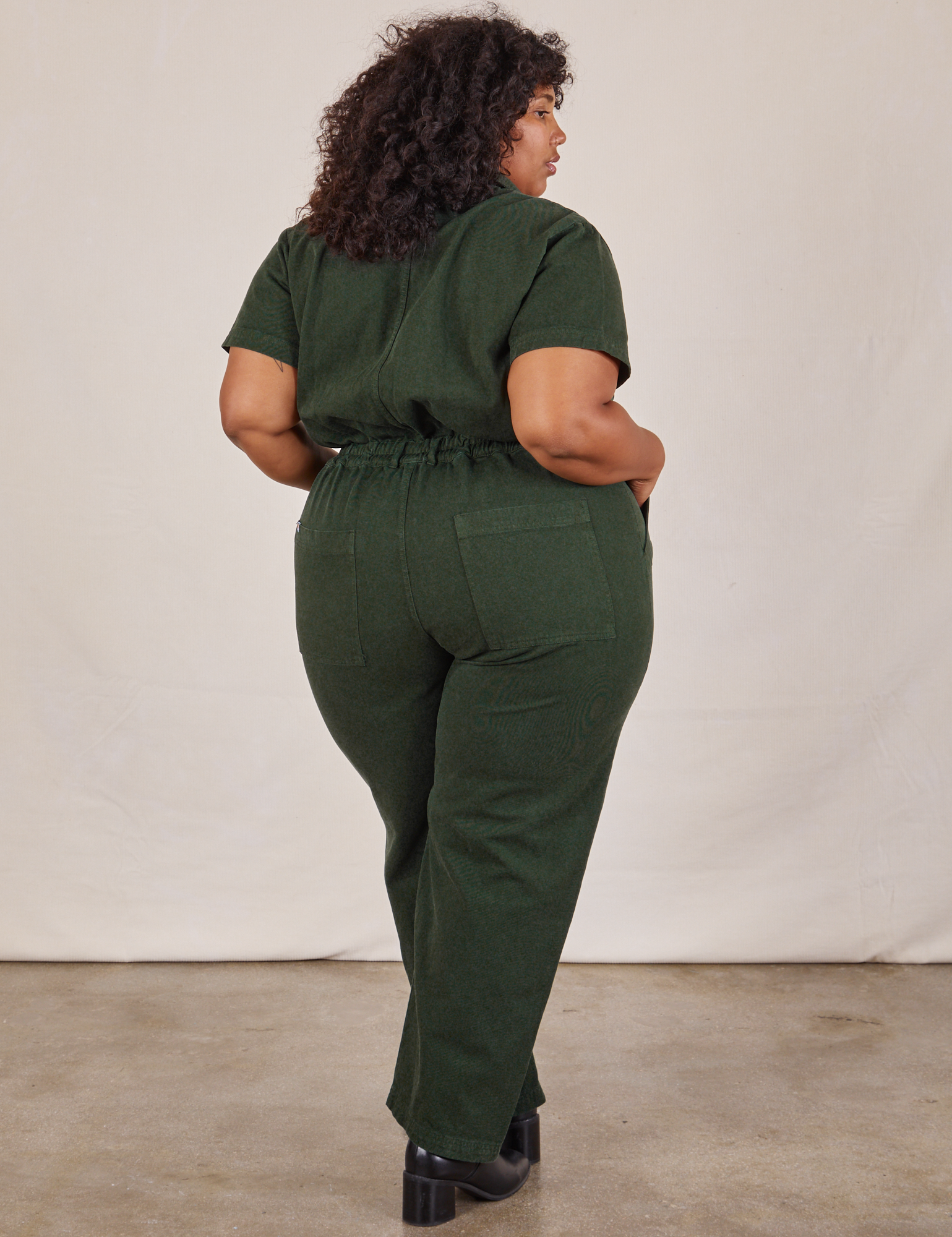 Short Sleeve Jumpsuit in Swamp Green back view on Morgan
