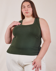 Marielena is 5'8" and wearing 1XL Tank Top in Swamp Green