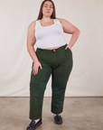 Marielena is wearing Work Pants in Swamp Green and Cropped Tank Top in vintage tee off-white