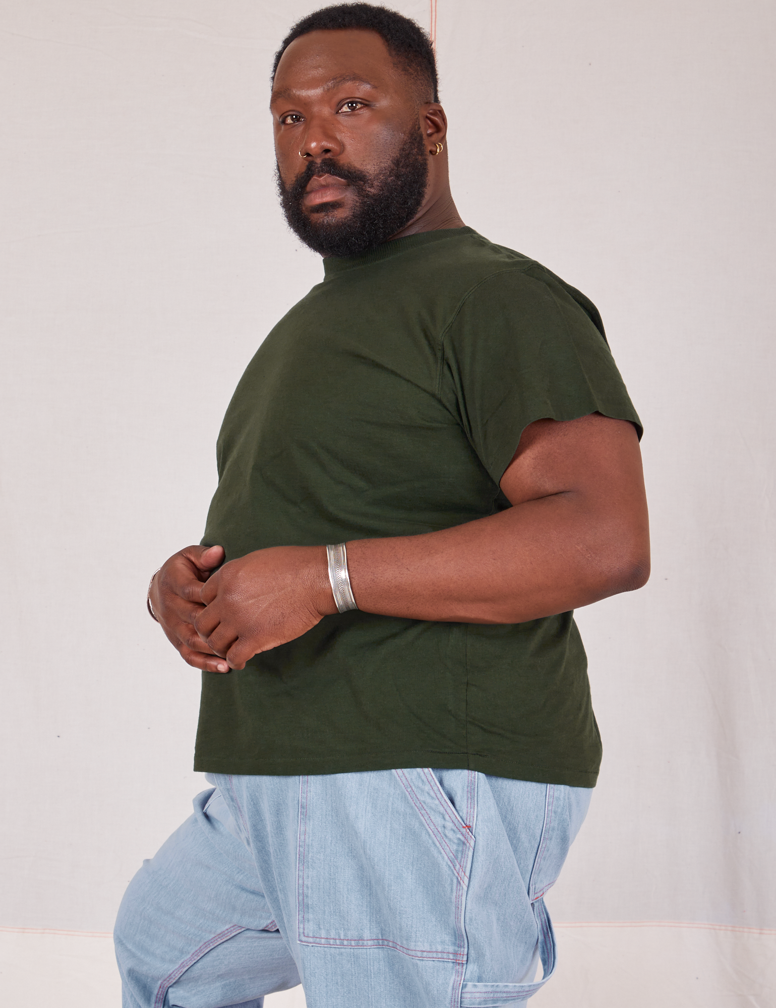 Organic Vintage Tee in Swamp Green side view on Elijah