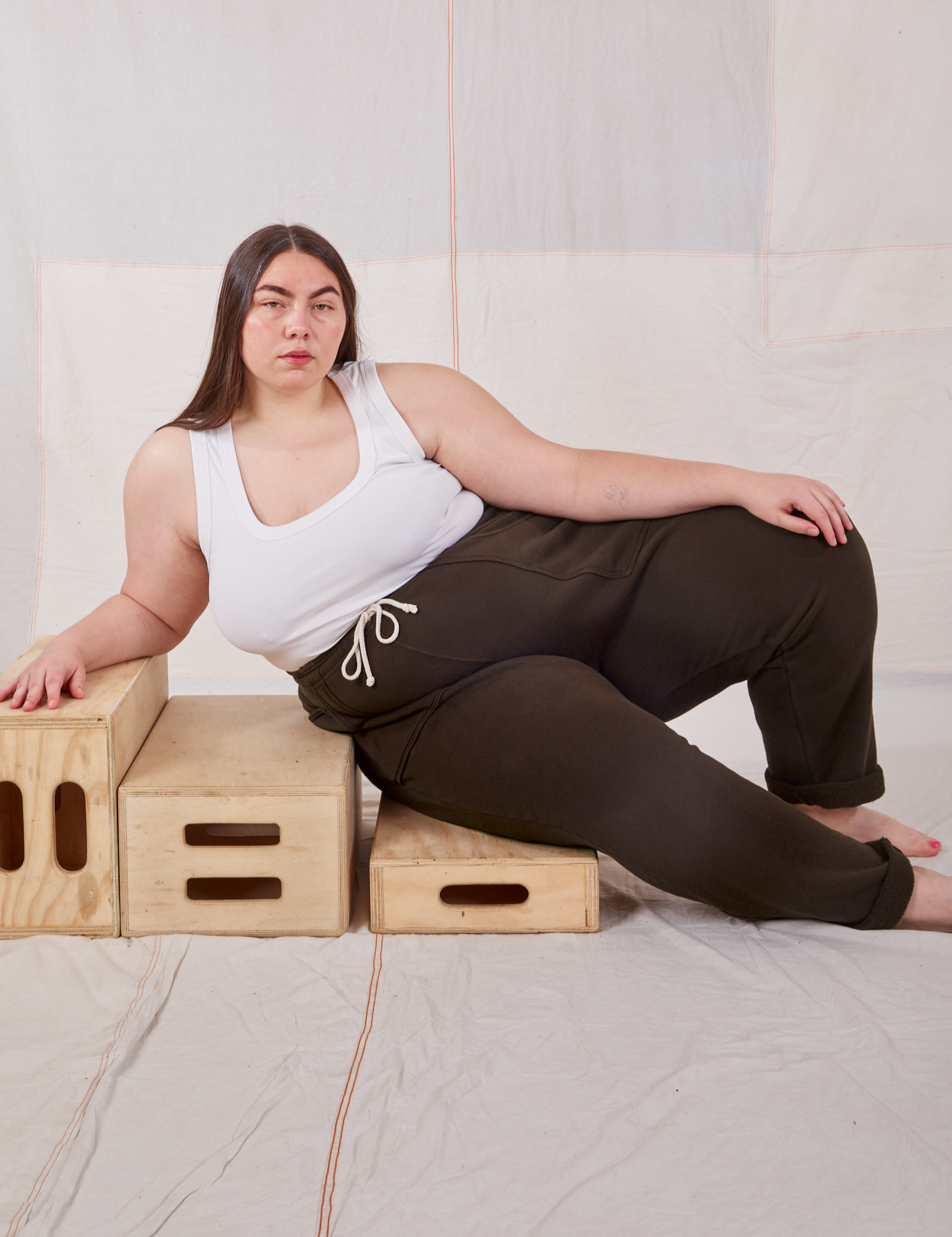 Marielena is wearing Rolled Cuff Sweat Pants in Espresso Brown and Cropped Tank in vintage tee off-white 