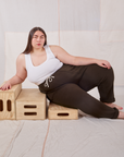 Marielena is wearing Rolled Cuff Sweat Pants in Espresso Brown and Cropped Tank in vintage tee off-white 