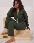 Kandia is wearing Rolled Cuff Sweat Pants in Swamp Green and matching Cropped Zip Hoodie