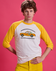 Quinn is 6'3" and wearing M Taxi Raglan Tee in Toronto