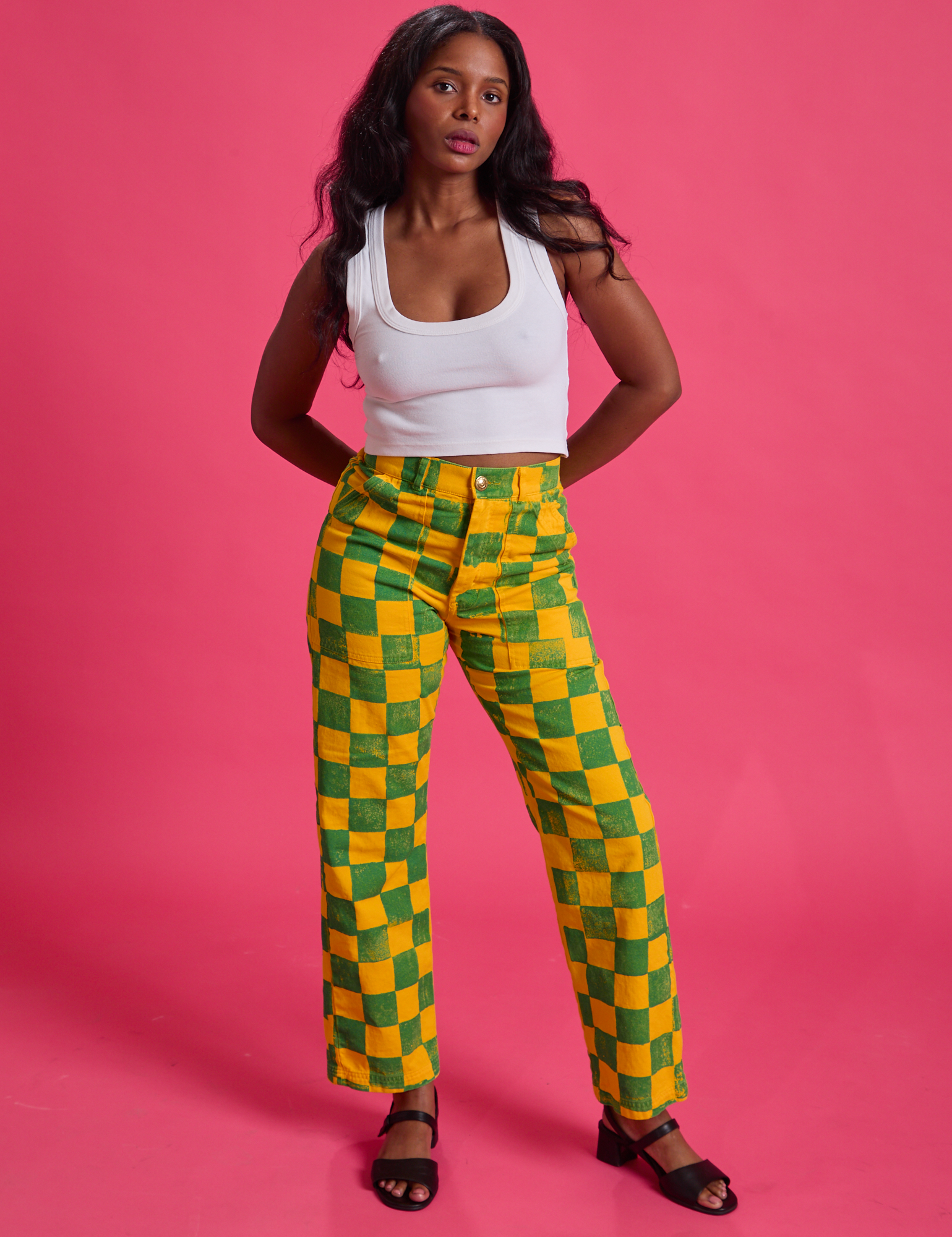 Kandia is wearing Checkerboard Work Pants in Green/Yellow and Cropped Tank in Vintage Tee White