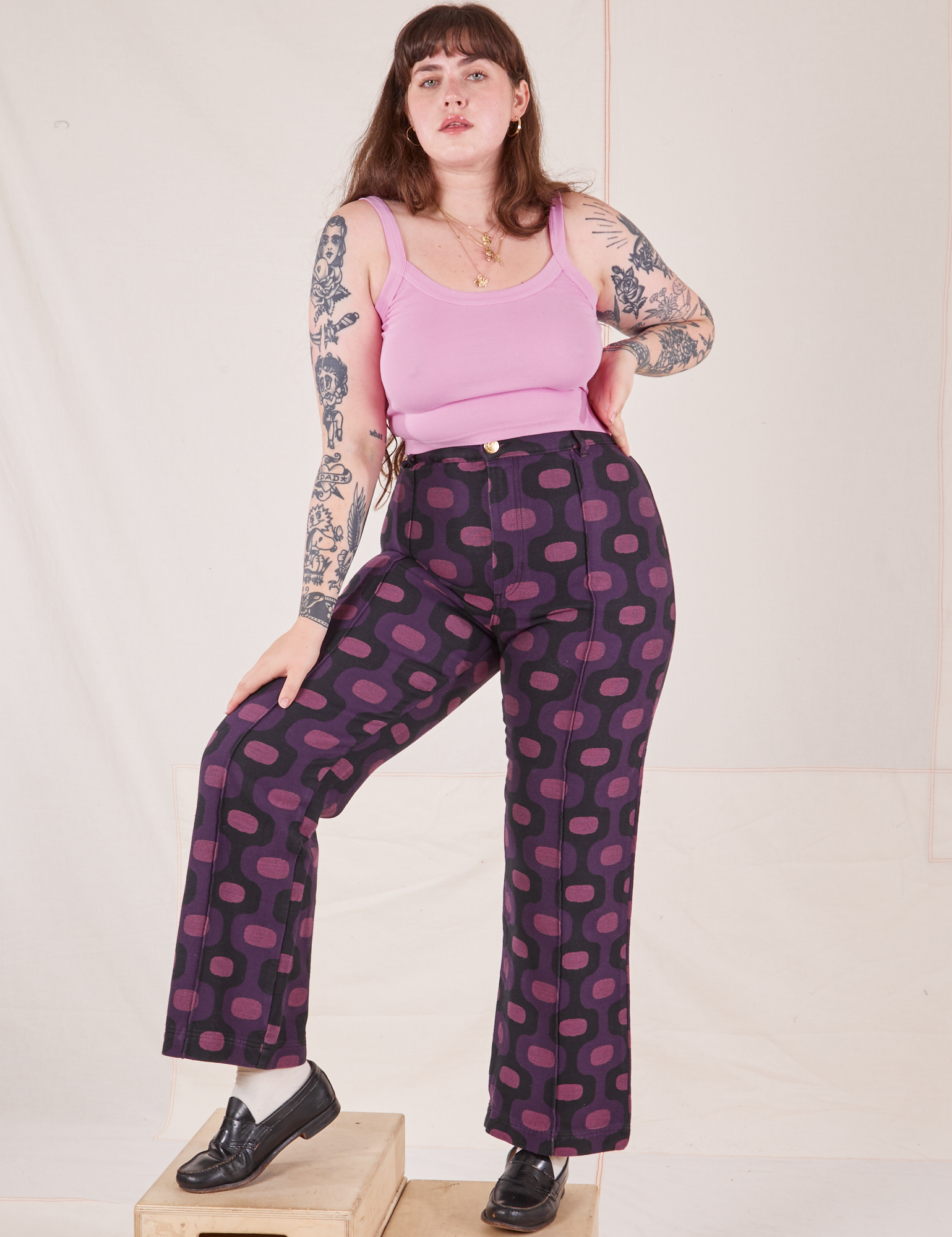 Sydney is 5&#39;9&quot; and wearing L Western Pants in Purple Tile Jacquard paired with bubblegum pink Cami