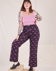 Sydney is 5'9" and wearing L Western Pants in Purple Tile Jacquard paired with bubblegum pink Cami