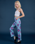 Side view of Floral Painted Work Pants in Blue and Cropped Tank in Vintage Tee White on Madeline