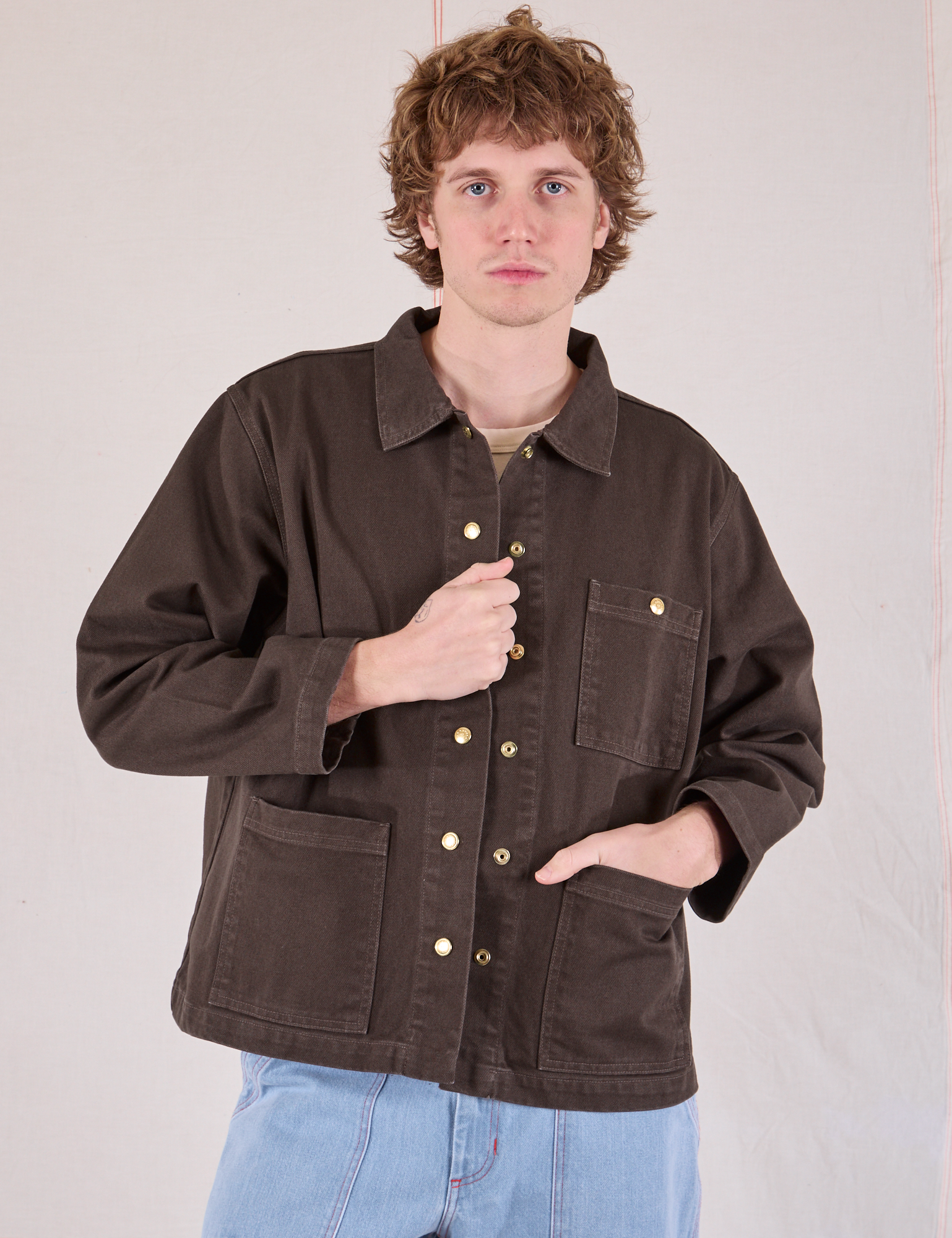 Quinn is 6'4" and wearing L Denim Work Jacket in Espresso Brown