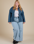 Juliet is wearing Denim Work Jacket in French Blue and light wash Indigo Wide Leg Trousers