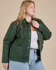 Angled front view of Denim Work Jacket in Swamp Green on Juliet