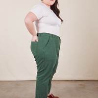 Work Pants in Dark Emerald Green side view on Ashley wearing vintage off-white Baby Tee