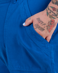 Close up of Sam's hand in the front pocket of Work Pants in Royal Blue