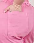 Classic Work Shorts in Bubblegum Pink back pocket close up. Ashley has her hand in the pocket.