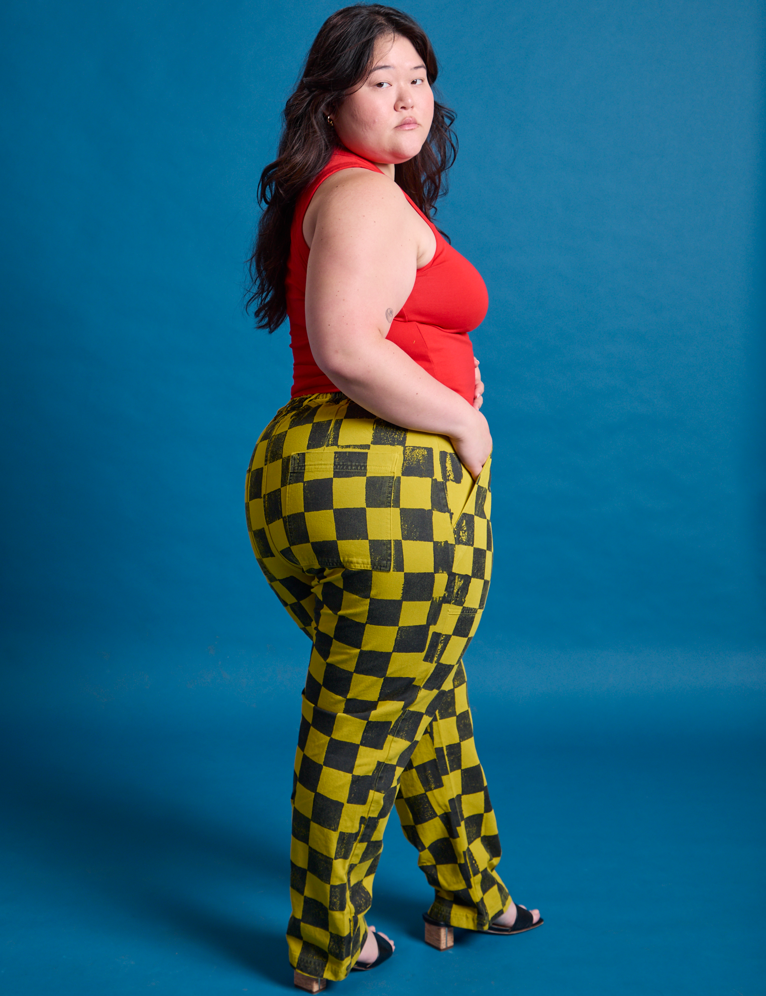 Checkerboard Work Pants in Yellow/Black angled back view on Ashley