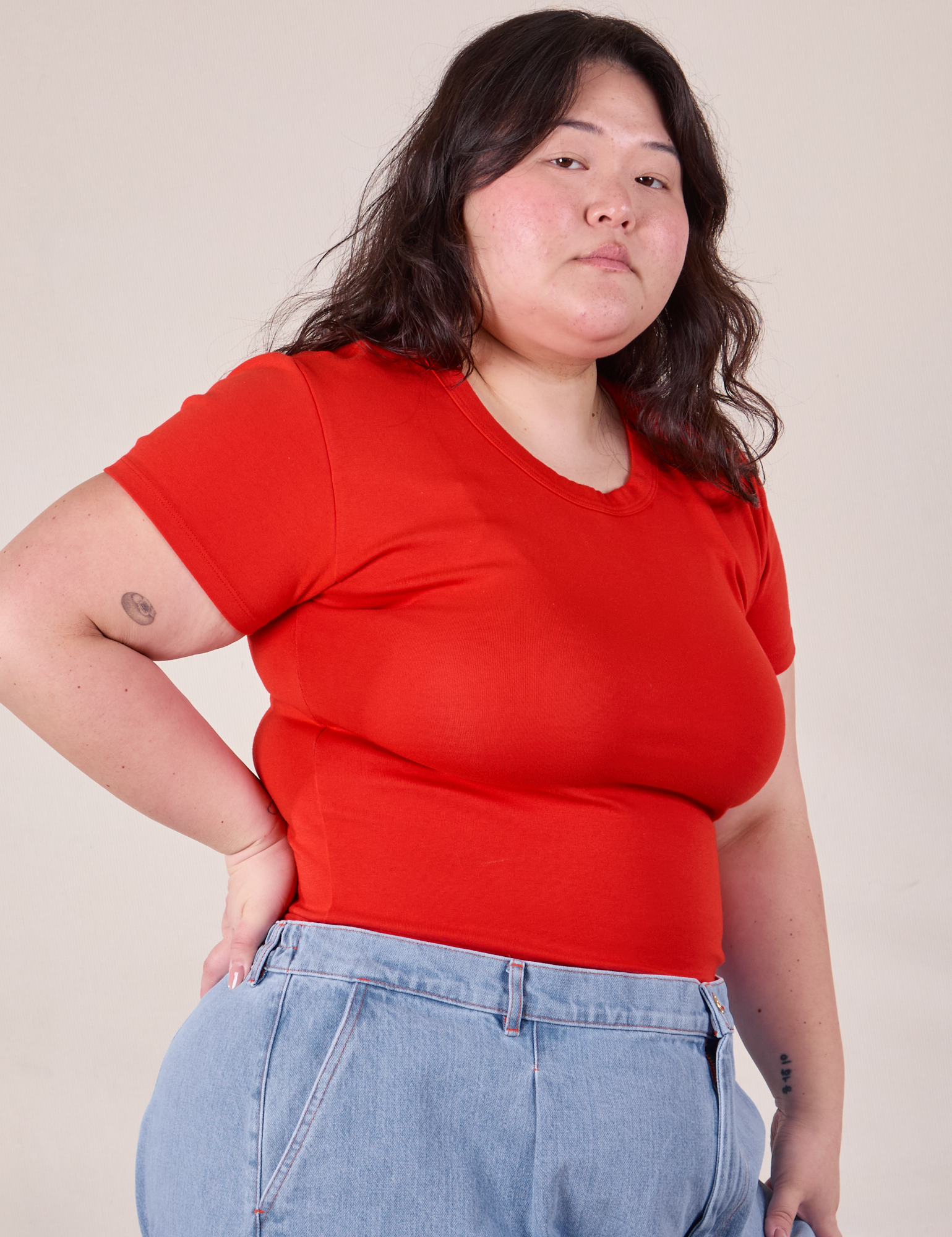 Baby Tee in Mustang Red angled front view on Ashley