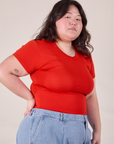 Baby Tee in Mustang Red angled front view on Ashley