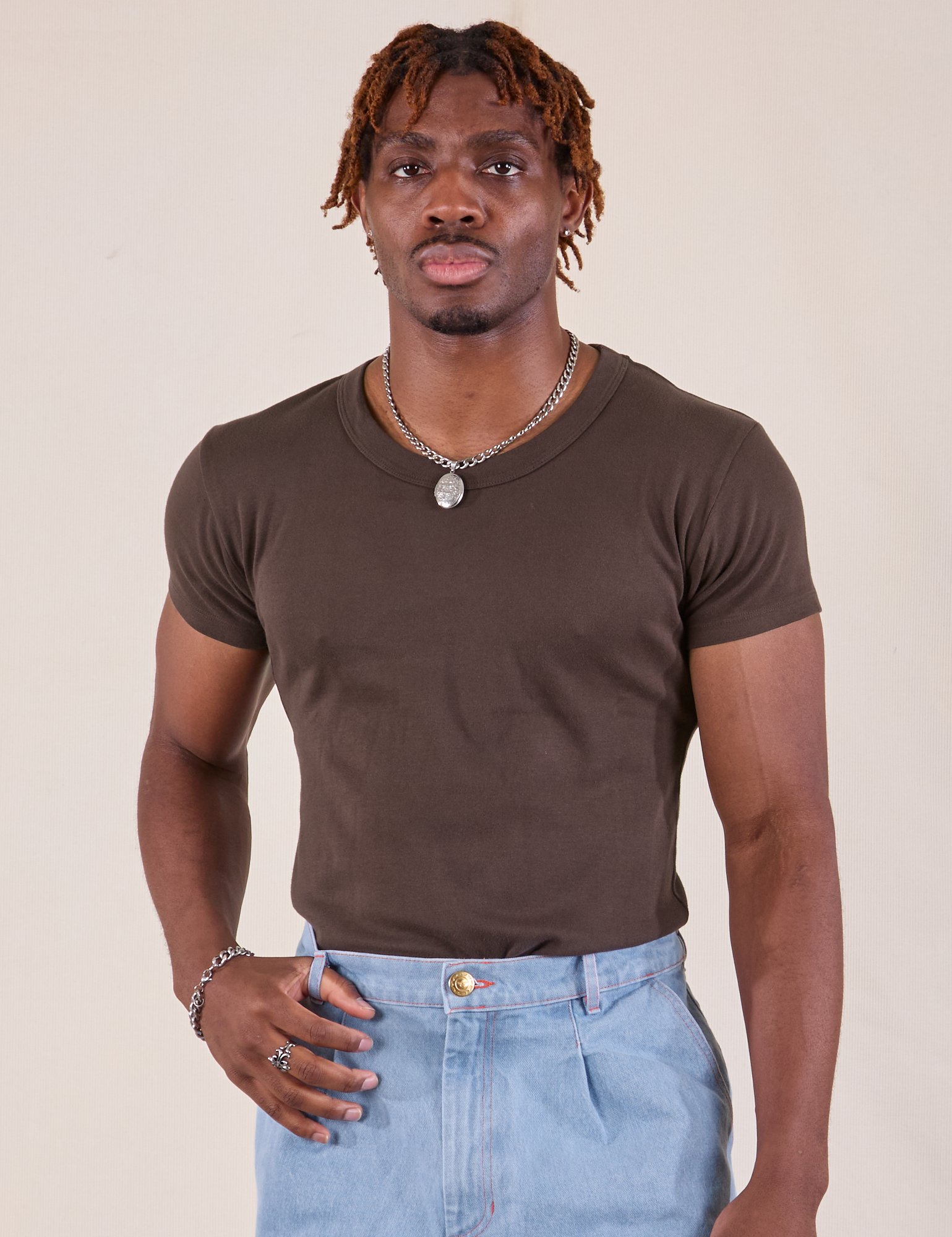 Isaac is 5'10" and wearing L Baby Tee in Espresso Brown