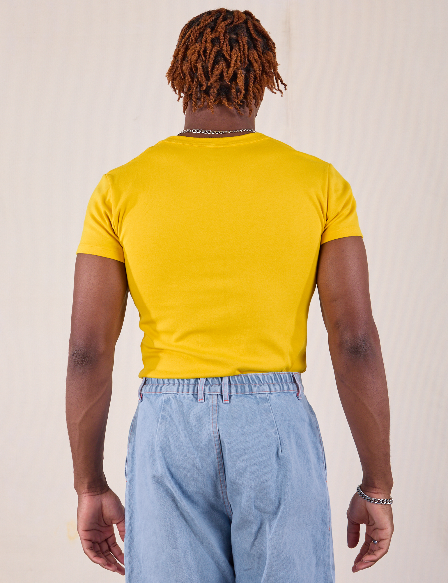 Baby Tee in Golden Yellow back view on Isaac