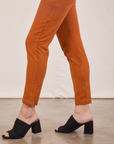 Pencil Pants in Burnt Terracotta pant leg side view close up on Alex