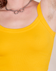 Front close up of Cropped Cami in Sunshine Yellow worn by Alex
