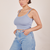 Angled view of Cropped Cami in Periwinkle and light wash Sailor Jeans worn by Tiara