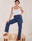 Tiara is 5'4" and wearing S Carpenter Jeans in Dark Wash paired with Cropped Cami in vintage tee off-white
