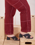 Railroad Carpenter Jeans in Mustang Red side pant close up on Bree