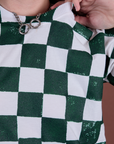 Checker Organic Tee in Swamp Green close up on Alex