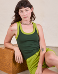 Alex is wearing Colorblock Cropped Tank in Swamp Green