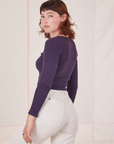 Angled back view of Long Sleeve V-Neck Tee in Nebula Purple worn by Alex