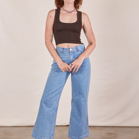Alex is wearing Cropped Tank Top in Espresso Brown and light wash Sailor Jeans