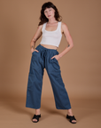 Alex is 5’8” and wearing XXS Drop Pocket Cargo Pants in French Blue paired with a Cropped Tank in vintage tee white