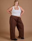 Drop Pocket Cargo Pants in Fudgesicle Brown and Cropped Tank in vintage tee white worn by Juliet