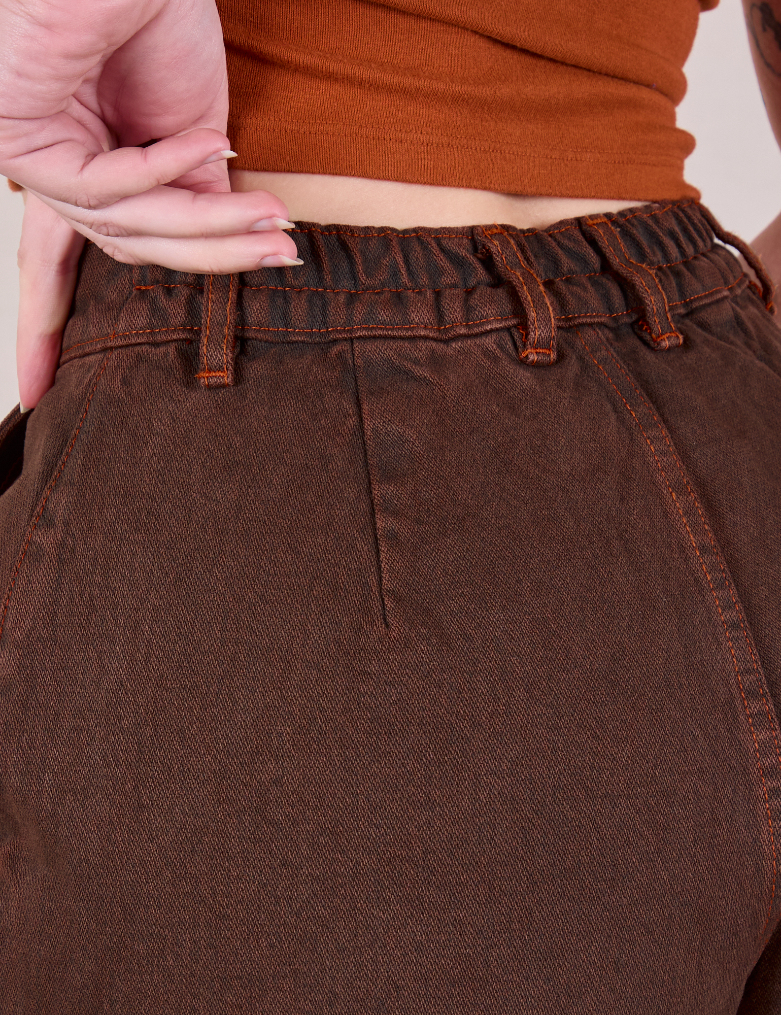 Overdyed Denim Trouser in Fudge back close up on Alex