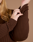 Close up of Long Sleeve Baby Tee in Fudgesicle Brown sleeve on Juliet