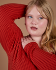 Gingham Long Sleeve Baby Tee in Mustang Red front close up on Juliet