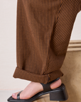 Checker Trousers in Brown & Black pant leg close up with bottom hem rolled up on Ashley