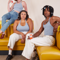 Alex, Alicia and Jerrod are sitting on yellow vinyl booths wearing Halter Top in Periwinkle