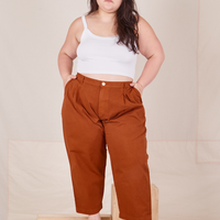 Ashley is 5'7" and wearing 1XL Petite Heavyweight Trousers in Burnt Terracotta paired with vintage off-white Cropped Cami