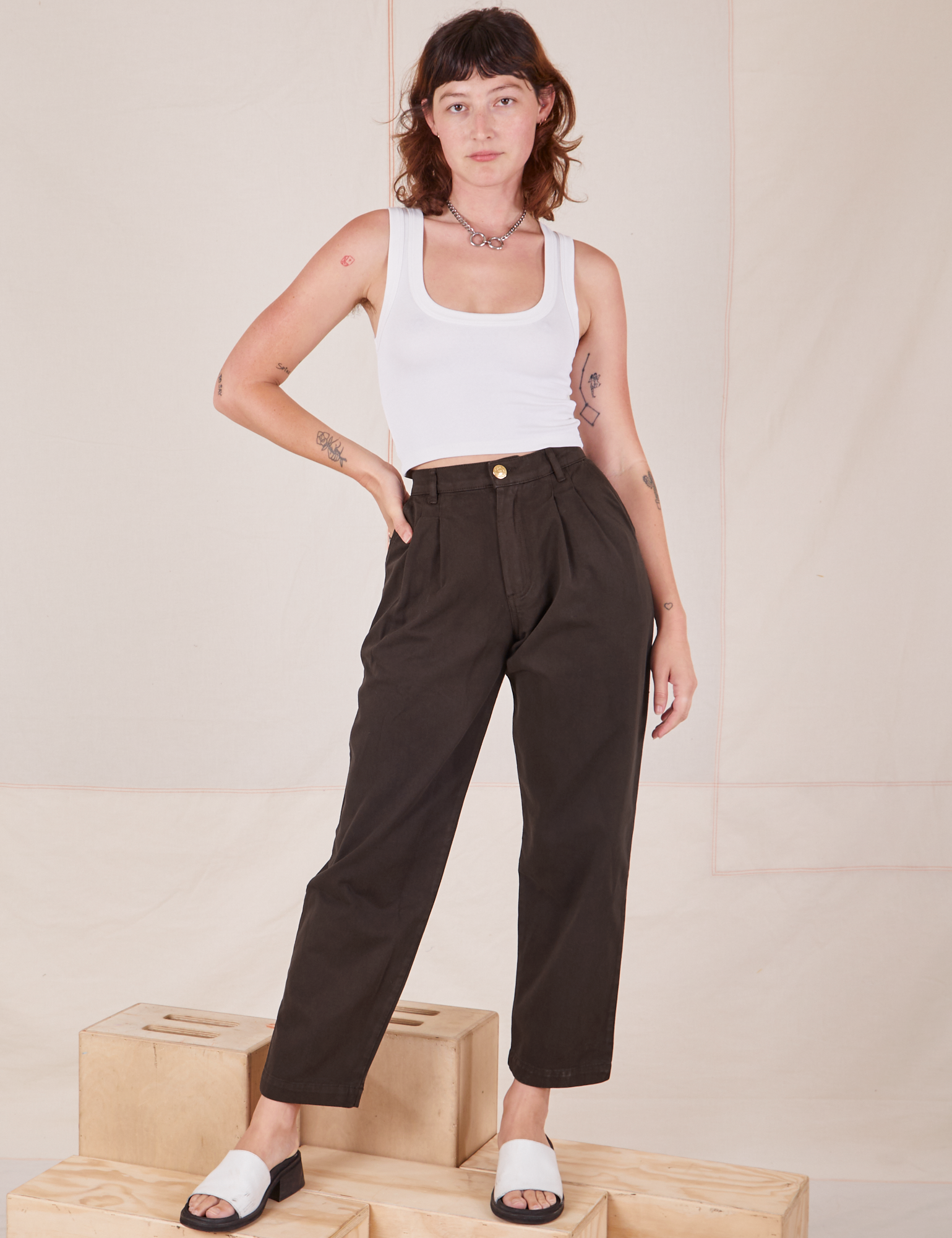 Alex is 5&#39;8&quot; and wearing XXS Heavyweight Trousers in Espresso Brown paired with Cropped Tank Top in vintage tee off-white