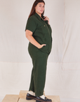 Heritage Short Sleeve Jumpsuit in Swamp Green side view on Katie