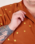 Icon Pantry Button-Up in Stars front close up. Sam is holding the collar.
