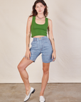 Alex is 5'8" and wearing XXS Carpenter Shorts in Light Wash paired with lawn green Cropped Tank