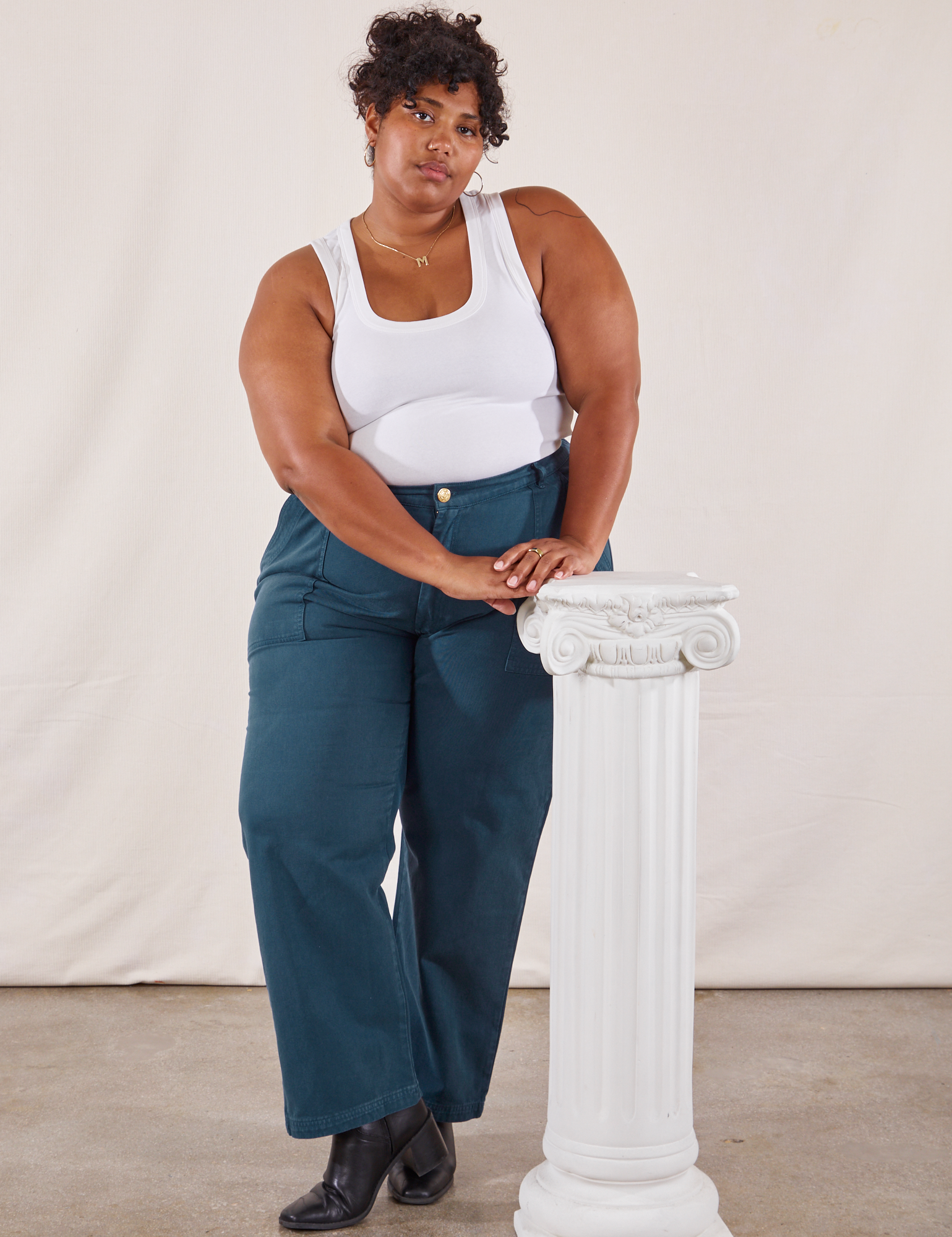 Morgan is wearing Work Pants in Lagoon and vintage tee off-white Tank Top