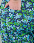 Close up of Juliet's hand in the back pocket of Angel Print Jumpsuit