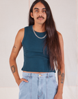 Anthony is 5’10” and wearing S Muscle Tee in Lagoon