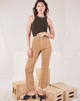 Alex is wearing Racerback Tank in Espresso Brown and tan Work Pants