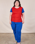 Ashley is wearing Mismatched Tee in Red & Blue and royal blue Western Pants