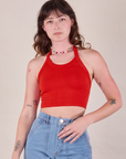 Alex is 5'8" and wearing P Halter Top in Mustang Red